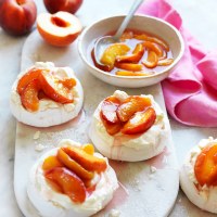 Mini pavlovas with poached peaches